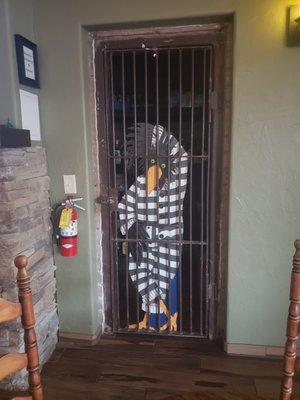 Saloon prisoner. I think he forgot to pay his bill.