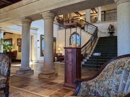 Inside the clubhouse lobby. Beautiful large golf paintings of THE PLAYERS Championship past. THE PLAYERS Championship trophy.