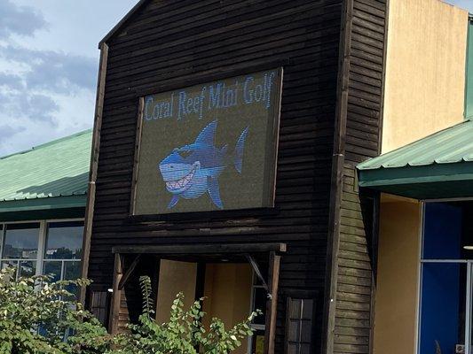 Neon sign out front of the building