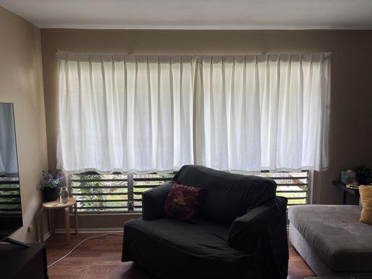 These curtains used to drag on the floor. Took them to Ken's and had it hemmed to 56" inches allowing air to flow through the house.