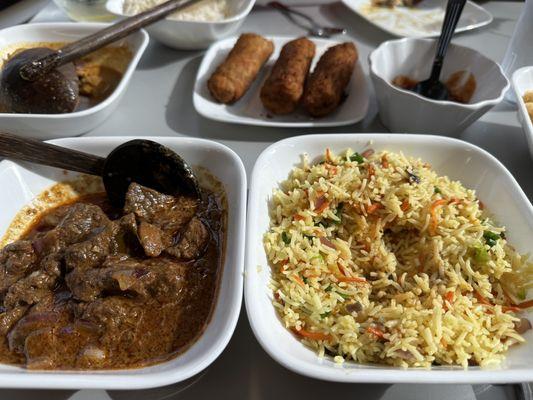 Beef curry bowl, vegetable fried rice, chicken rolls