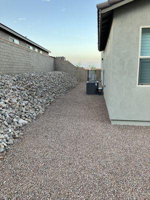 Large rock wall with smaller path rock