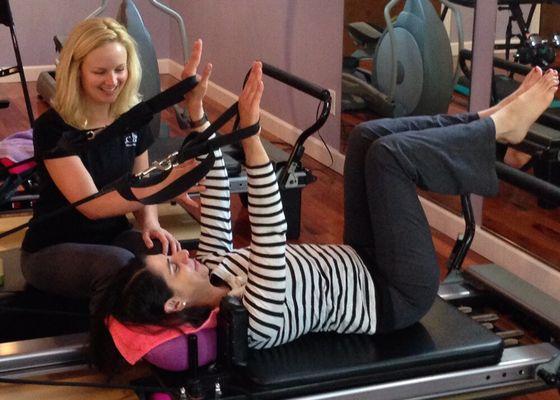 Working out in the Reformer builds core strength while toning arms and back