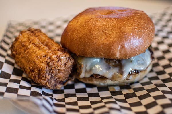 Texas Heat - Pork patty, jalapeno relish, fried onions, and Pepper Jack served with fried sweet corn