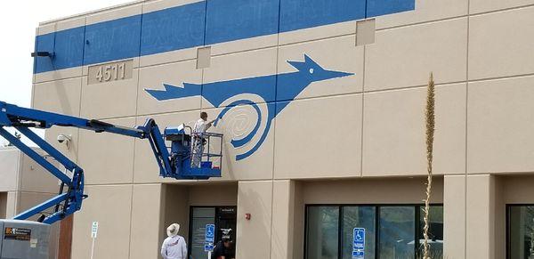 Painting the NM Lottery Logo on their building during a remodel