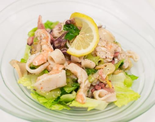 Sicilian Fish Salad - A fresh mix of shrimp, calamari, octopus, and scungilli tossed in a homemade lemon vinaigrette