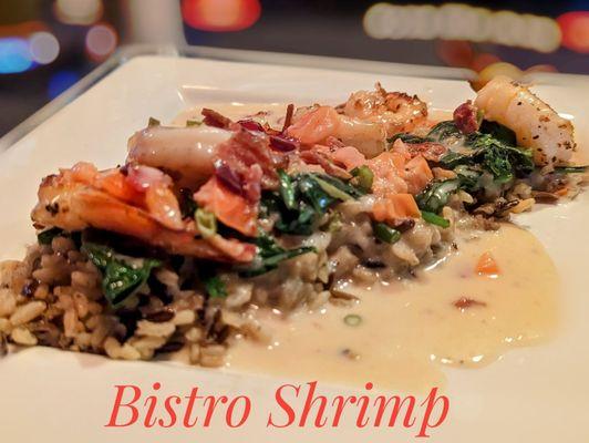 Shrimp with a creamy garlic sauce, spinach, bacon, and rice. Delicious