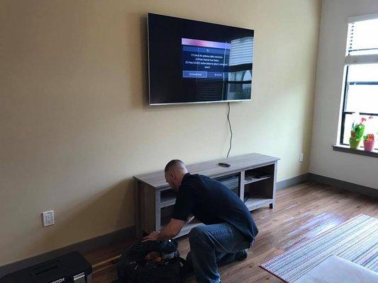 Assembly Smart installing a flatscreen TV wall mount for a customer on the Southside