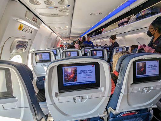 Inside a Boeing 737-900ER. View from seat 20B. Exit row. Delta flight DL0443 ATL to SFO.