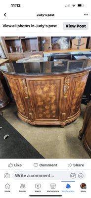 Heavy wooden bar with marble top, great for a mancave