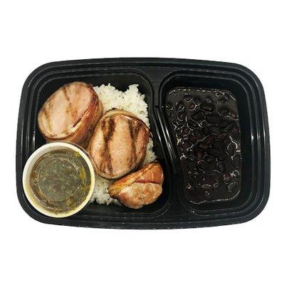 Grilled Bacon Wrapped Pork Tenderloin served with White Rice & Black Beans with a side of Chimichurri Sauce