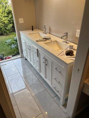 Bathroom vanity install and sink installation with plumbing