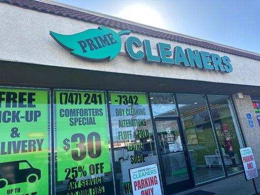 Logo and front windows of the business.