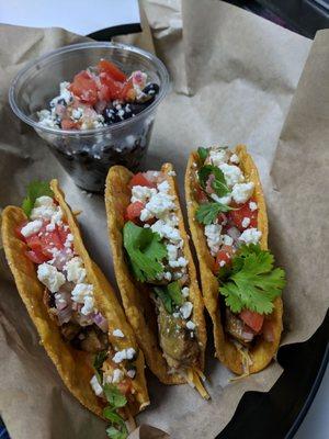 Carne Asada tacos with a side of black beans