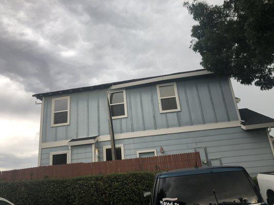 Gutter hanging off the side of the house