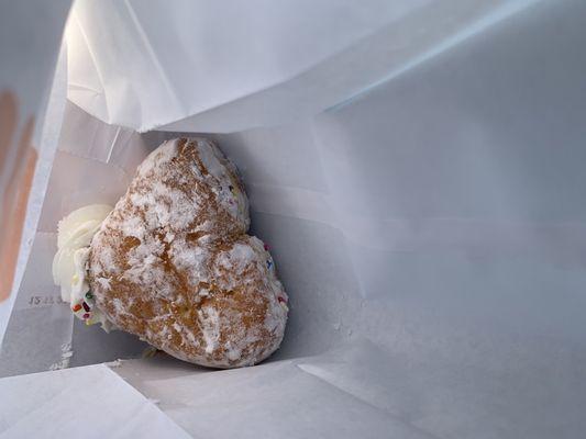 Heart-shaped donut STUFFED full of vanilla creme. Fresh and delish!