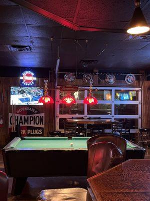 Pool table and garage door access to patio