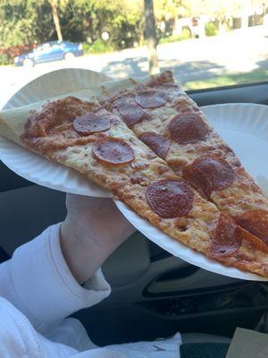 Pepperoni Pizza Slice requires two plates- and this one is sliced in half.