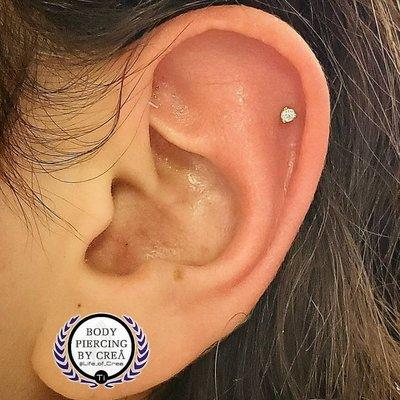 Helix piercing with a 14k gold cz top. Body Piercing by Crea at Z-Edge Tattoo and Body Piercing in Sarasota