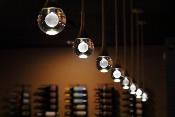 Pendant lights over the bar.