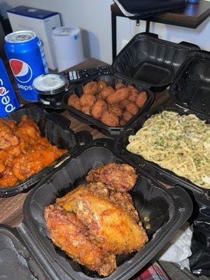 Buffalo Wings (top left) Lemon Pepper (lower left) Garlic noodles (bottom right) Cheese Curds (top right)