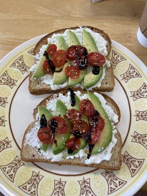 Yummy special, avocado, cottage cheese, tomato and balsamic vinegar toast.