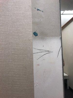 Gum squished on the wall