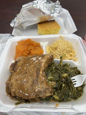 Smothered pork chop, greens, Mac n cheese, yams, and cornbread.