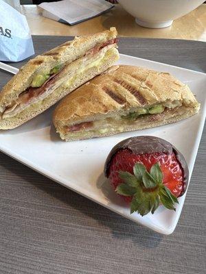 Turkey, bacon, avocado sandwich and chocolate strawberry for dessert