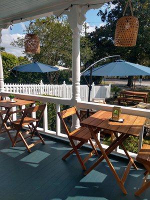 View from front porch. Tables for two.