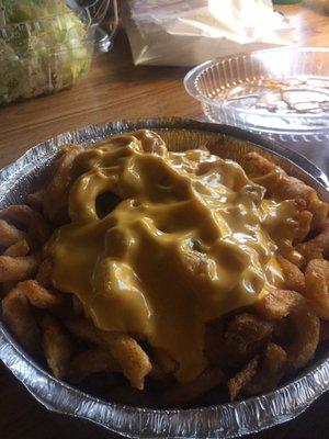 Curly fries with nacho cheese