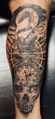 Black and gray skull with clock and pirate ship. Black and gray realism tattoo.