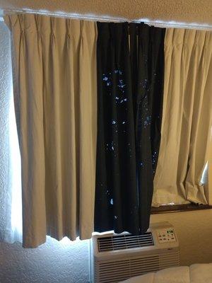 The curtains had large holes and let in the light from the very bright lamp outside.