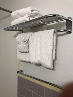 Note dingy towels, paint on  towel rack and rust on the towel