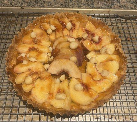 Your local peaches used in a macadamia nut crust tart.