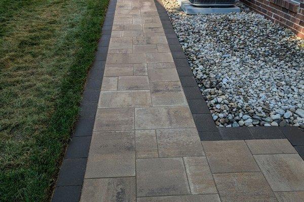 Macomb Twp project. Raised brick paver patio and brick paver walkway.  Retainer wall is Fendt, Keystone Compact Brick is Belg...