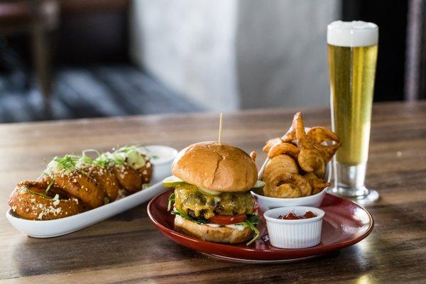 Our house-ground burger is made from short rib and chuck beef. So good! (Also shown: Buffalo Onion Rings)