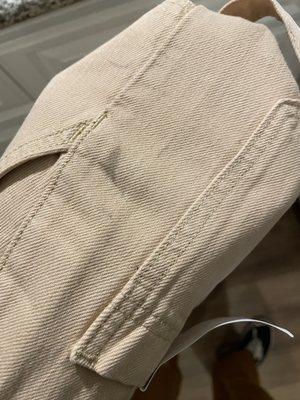 Dark stain on side of pants