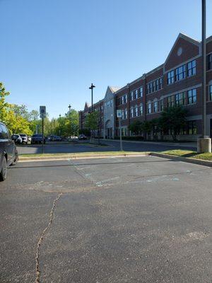 Side of building to back parking lot which has many spaces and a front handicap door entrance.  5/15/2023