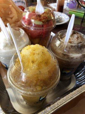 Mango, Coco, and Tamarindo nieve raspadas along with a cup of fruta and some duritos