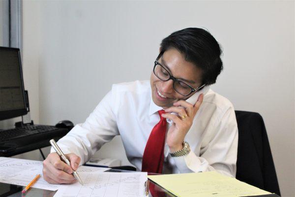 Koreatown Accountant Working with Clients on The Phone.