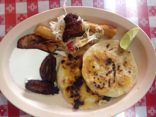 Combinado Tipica plate- $7.95 for 2 pupusas, plantains with cream, yucca frita, curtido and a piece of chicharron- yummo!!