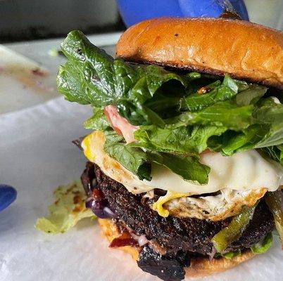 Garden Burger topped with Fried Egg, lettuce and provolone cheese