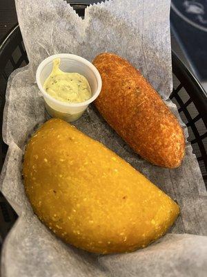 [left to right] empanada de maíz con pollo; alcapurria de yuca