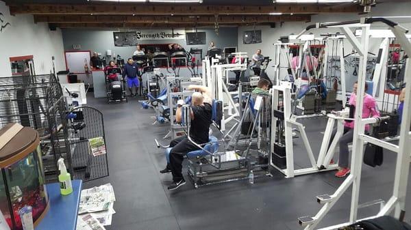 Our members going for it! Upstairs in the cardio and machine room.