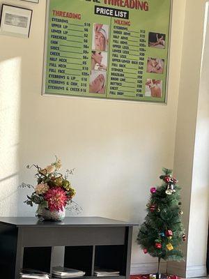 Christmas tree next to price list