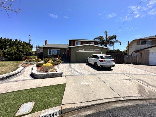 Separate utility spaces like driveways from landscape and paths. Add a contrasting border to encourage foot traffic to the front entry.