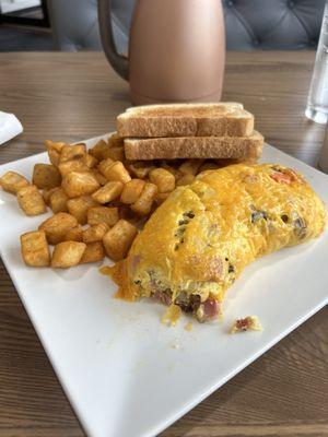 Everything omelette with breakfast potatoes, and sourdough bread