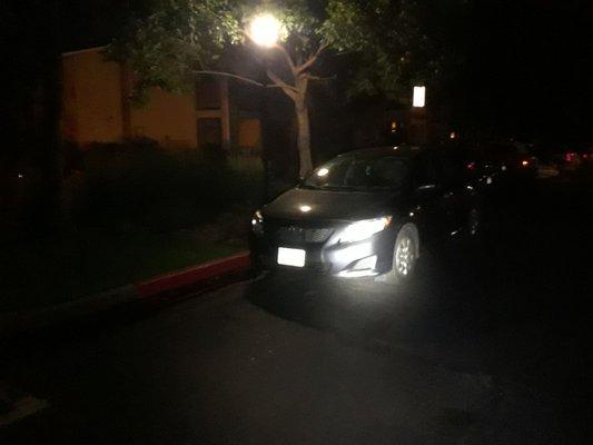 The Maxx Auto Recovery vehicle ironically parked in a fire lane, with a "tow away zone" sign only a few feet away.