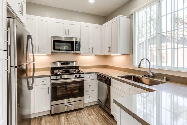 Renovated Unit Kitchen with Stainless steel appliances.